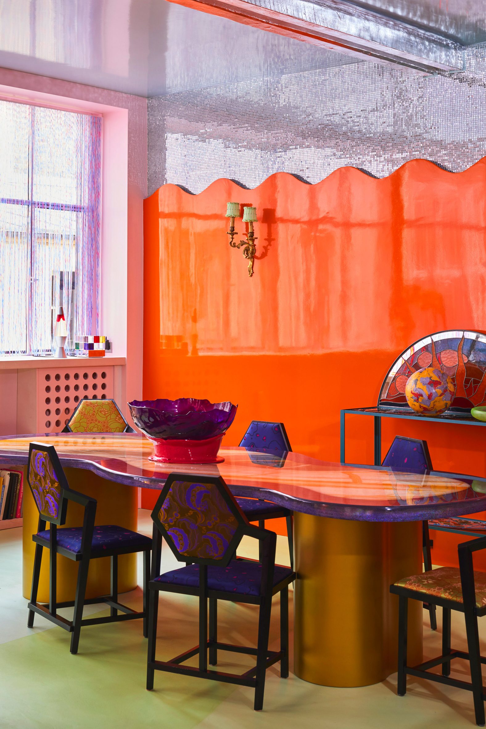 Dining room with silver ceiling and orange wall