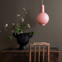 Photo of pink light and furniture by Emerson Bailey