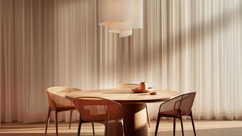 Photo of light hanging above wooden chairs and a table