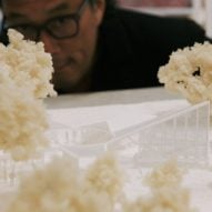 Closeup of architect Minsuk Cho and his model of Serpentine Pavilion 2024
