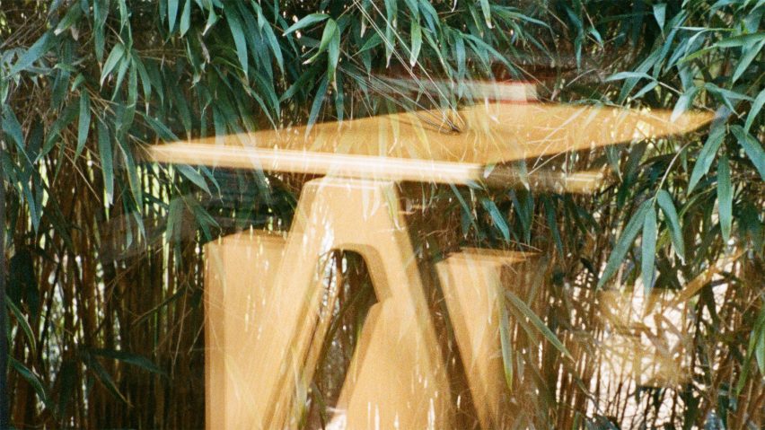 Blurry photo of a wooden table by &Tradition