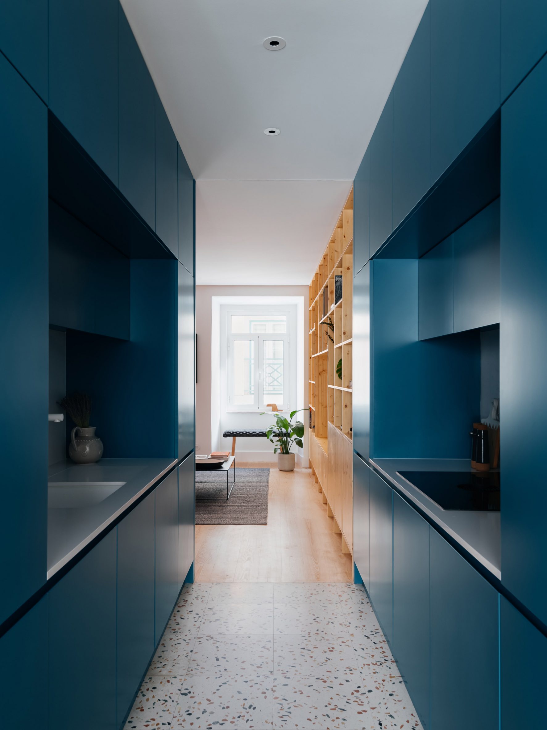 Blue kitchen at Lisbon apartment by ALA.rquitectos