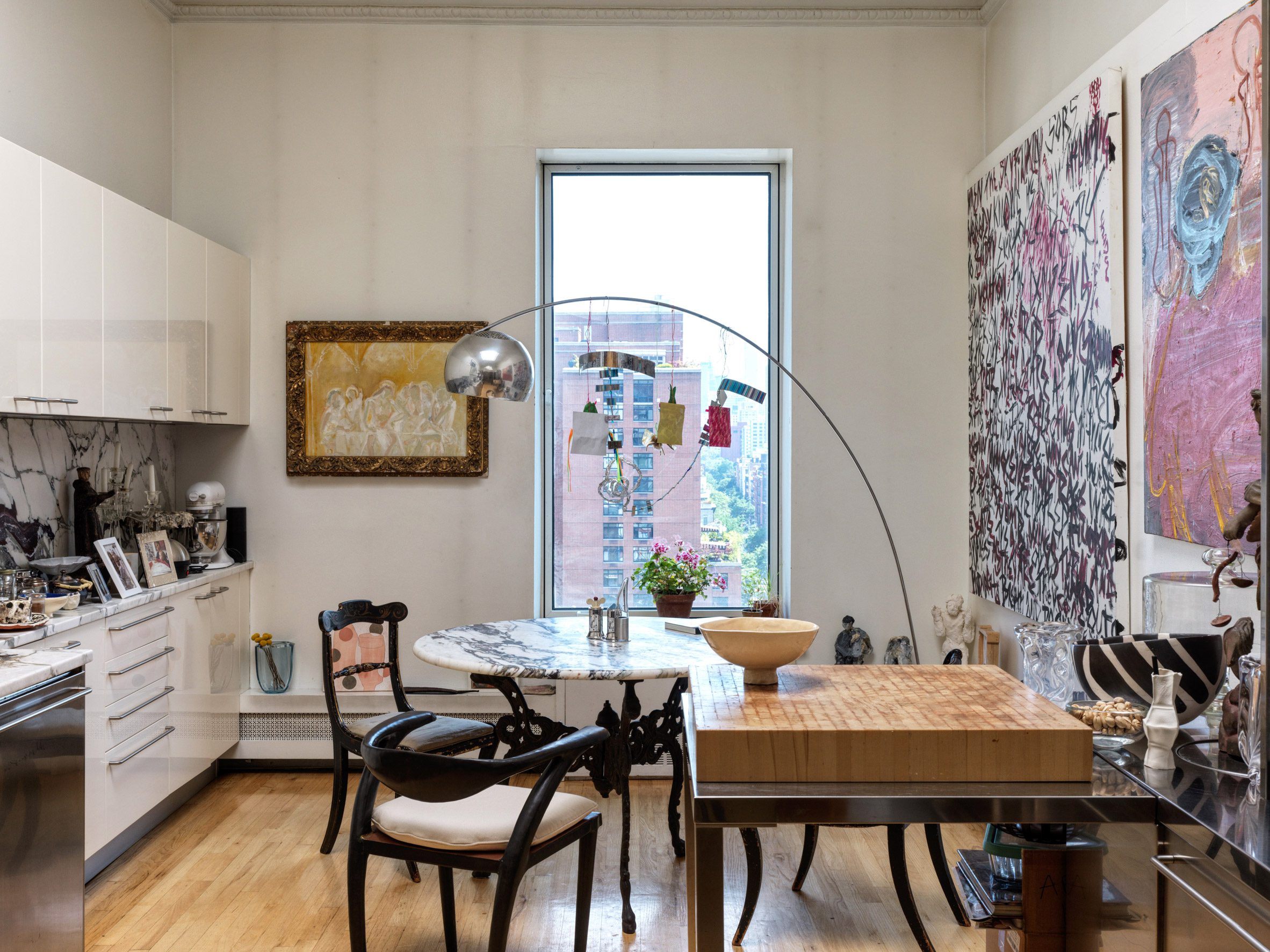 Eclectic mix of furniture and artwork in a kitchen