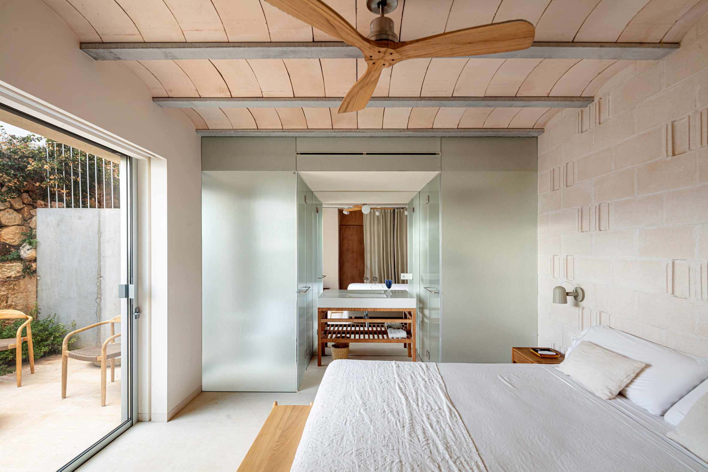 Bedroom interior at villa by Nomo Studio