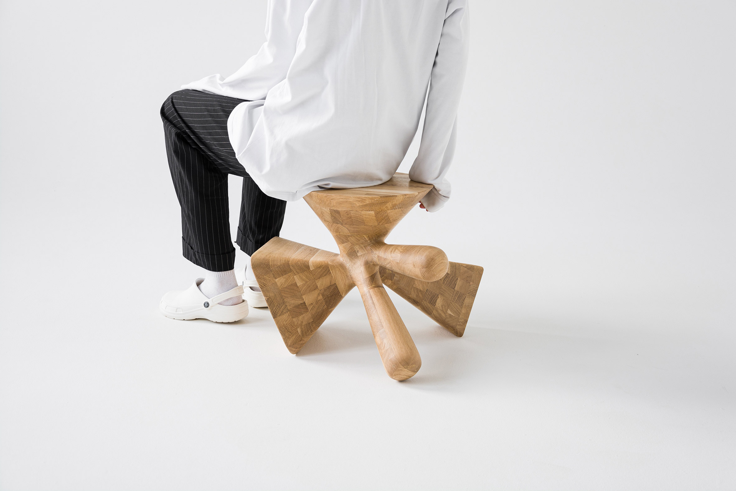 Multifaceted wooden furniture by Kosmos Architects
