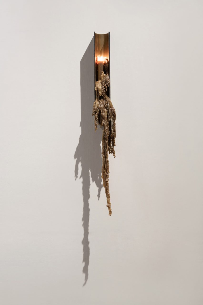 Candle on the wall of gallery