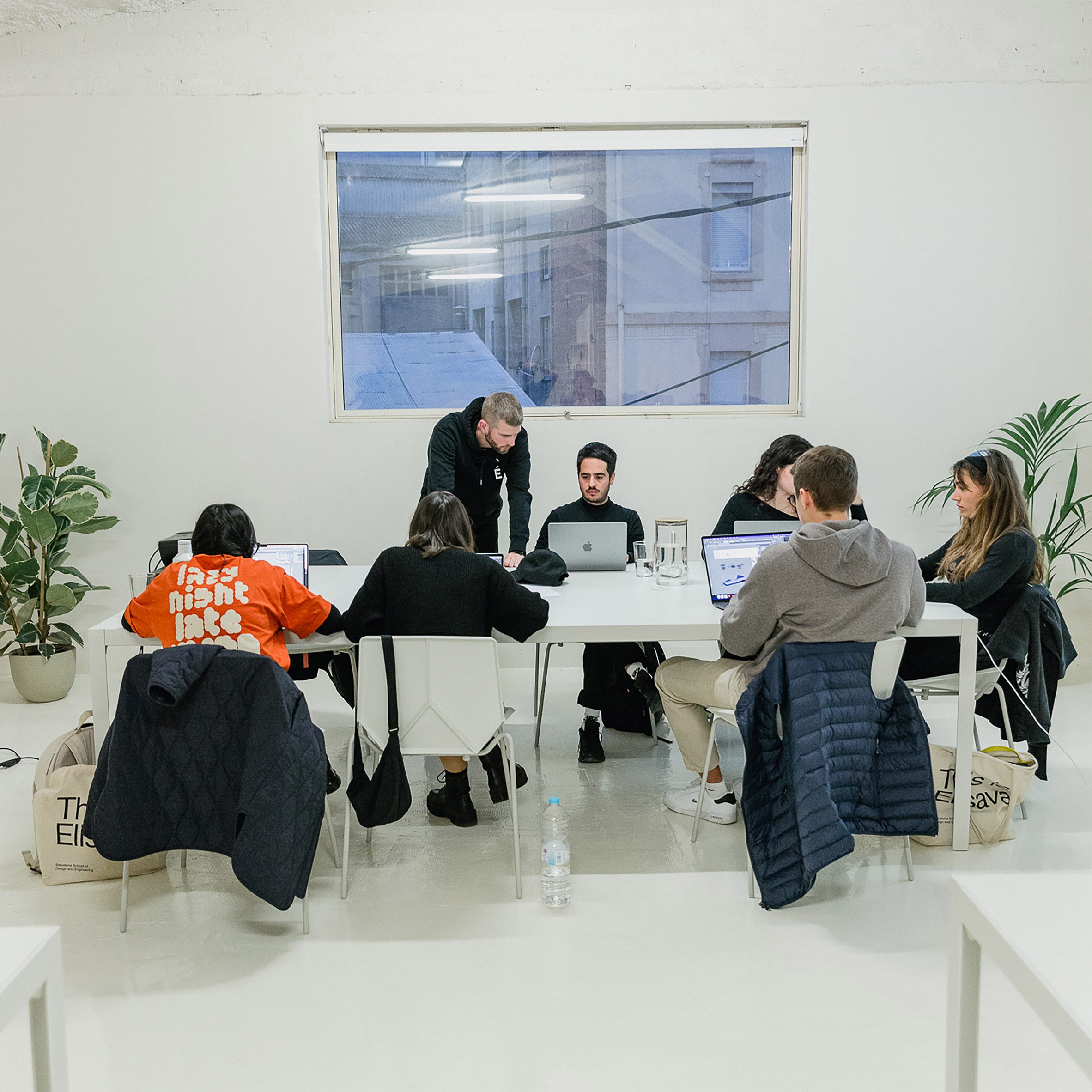 People working on laptops at a table