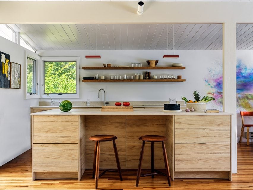 Kitchen with open shelving and a custom island