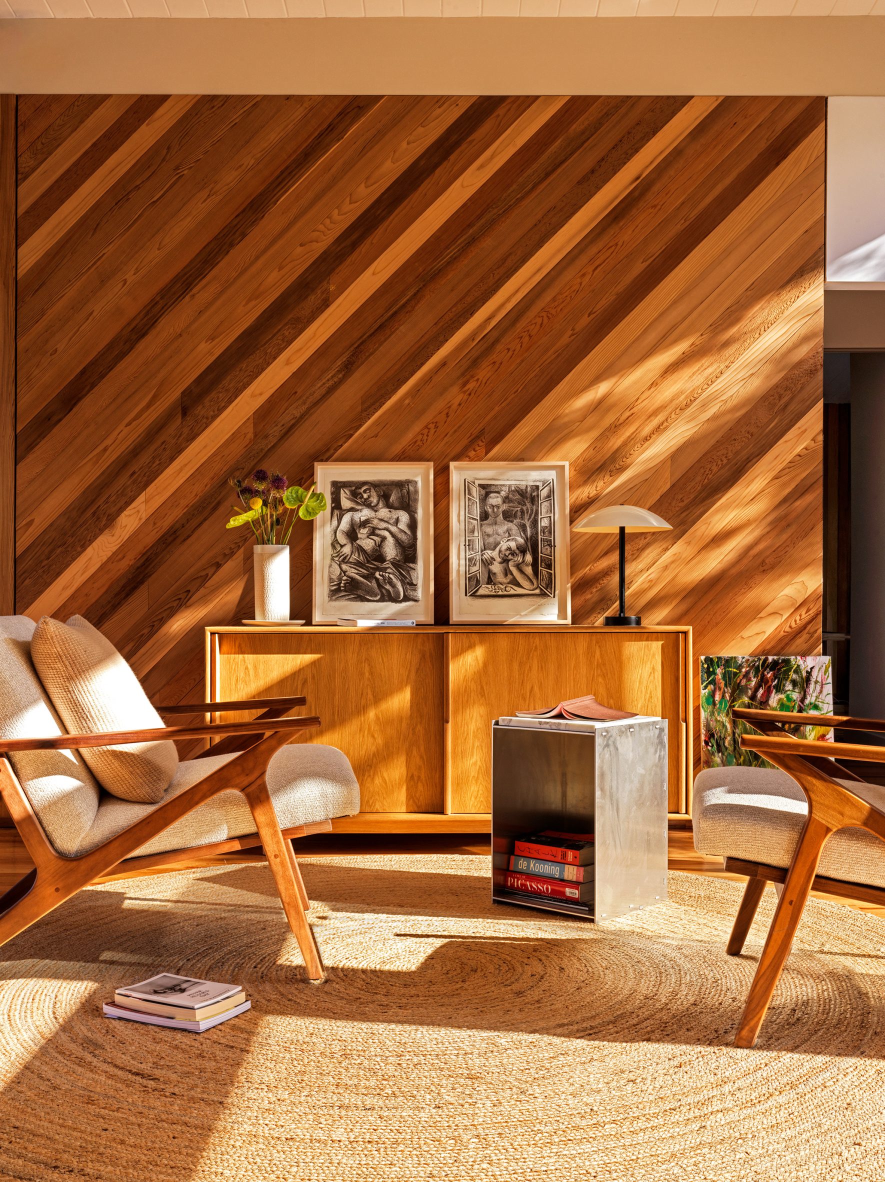Cedar panelling installed diagonally in a lounge area with armchairs