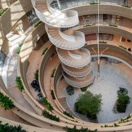 3XN wraps spiralling "innovation hub" around large atrium in Stockholm