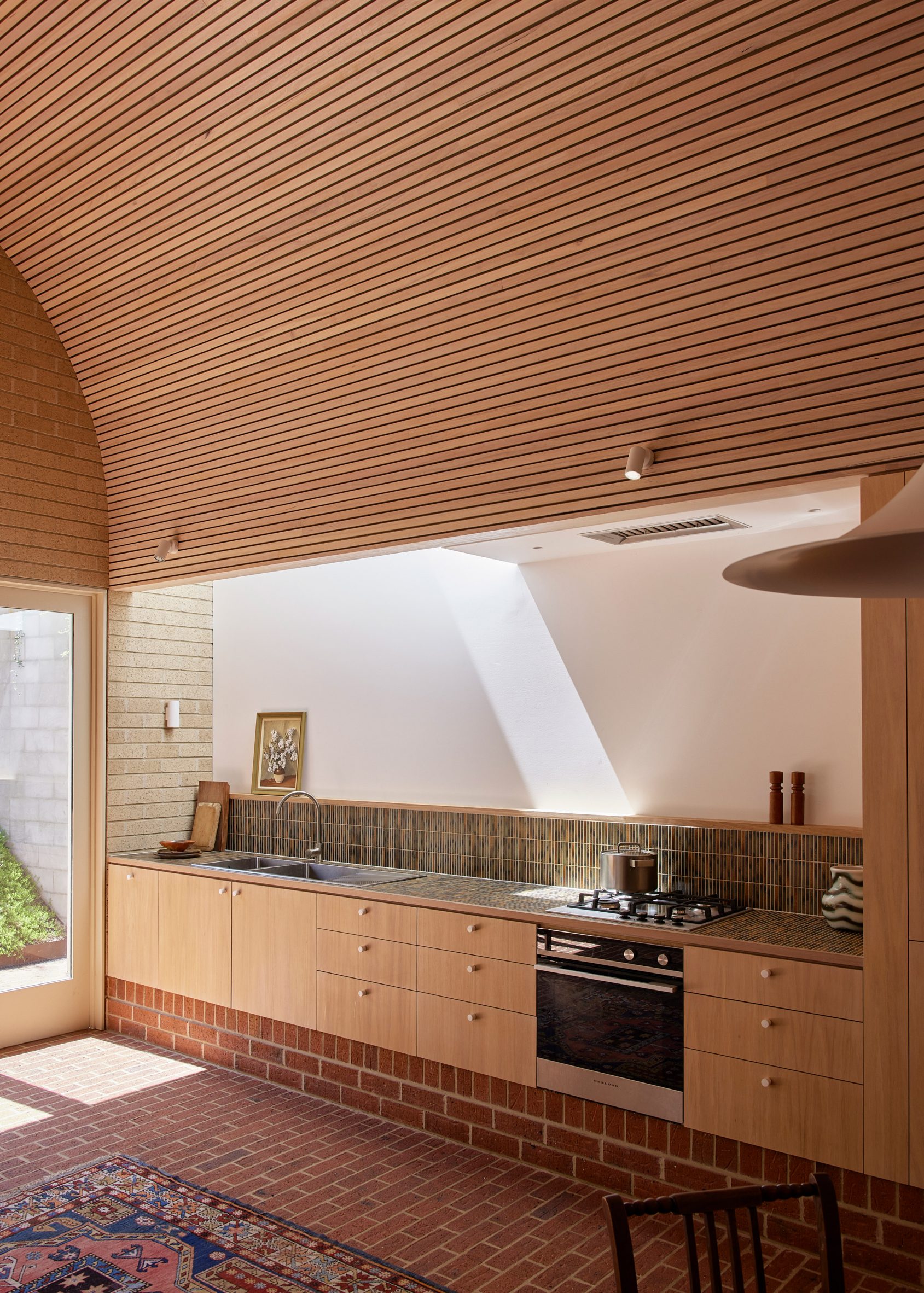 Kitchen area within residential extension by So Architecture