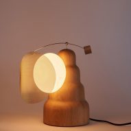 Wooden lamp with moveable shade