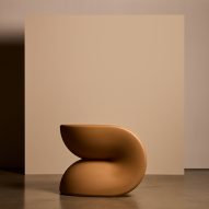 Brown chair against a cream chair