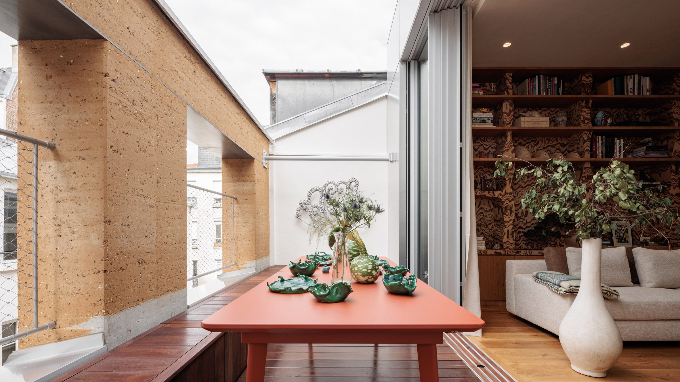 Rammed-earth wall fronts Parisian townhouse by Déchelette Architecture-0