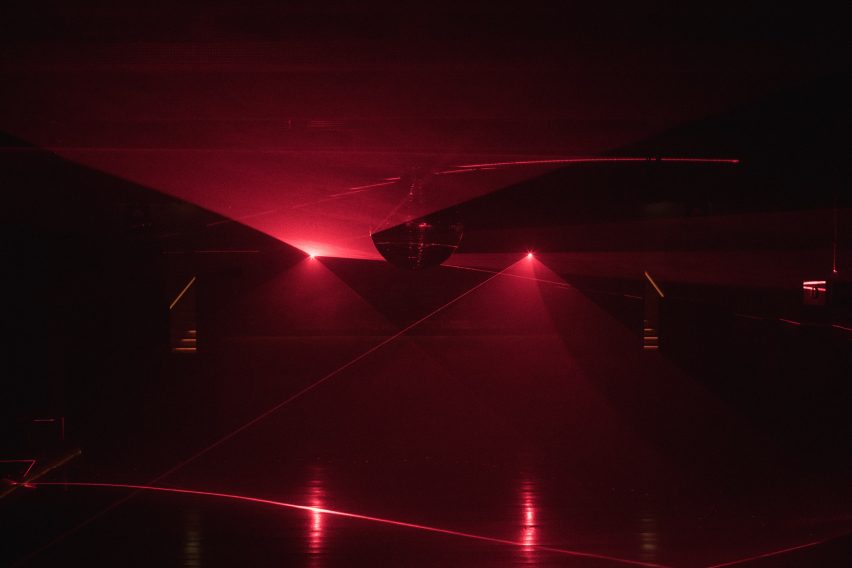 Dark nightclub with red laser lighting