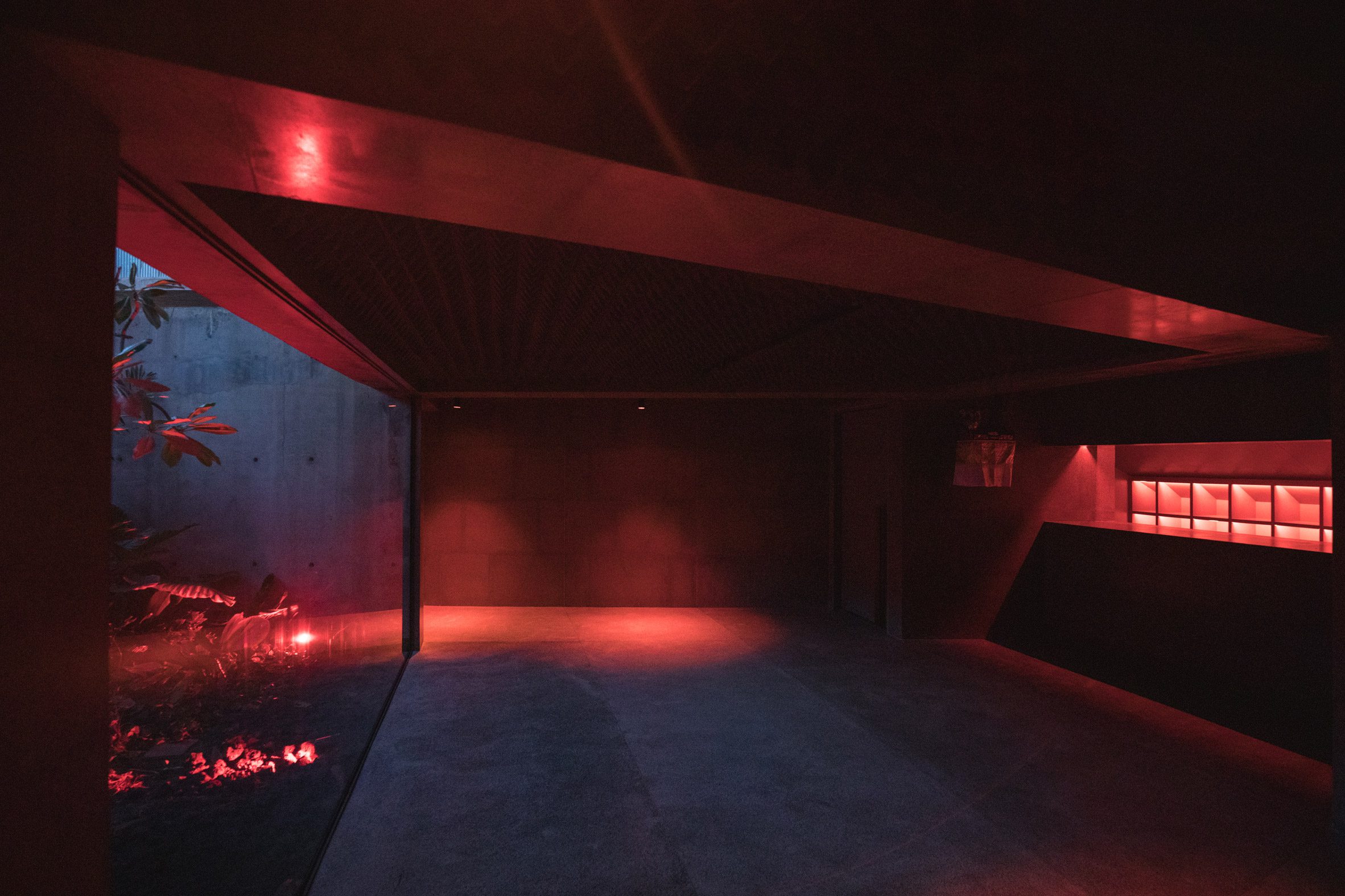 Concrete room with red lighting