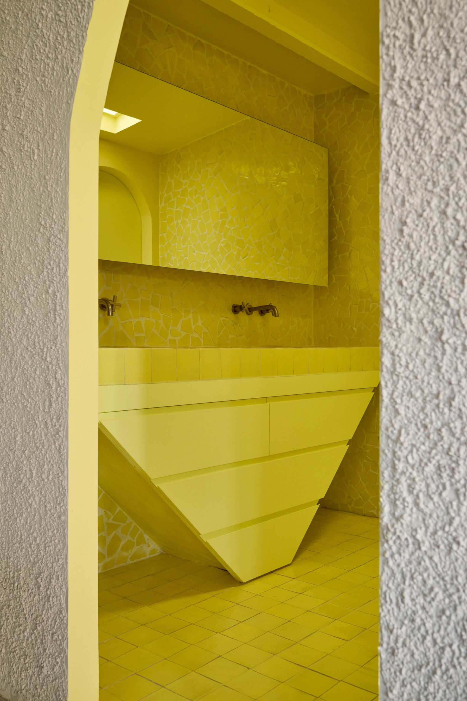 Yellow tile-clad bathroom