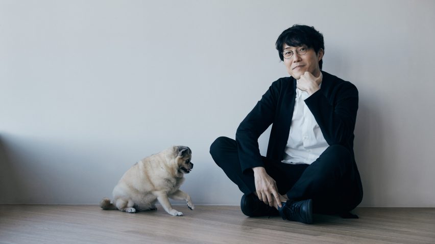 Portrait of designer Oki Sato with dog