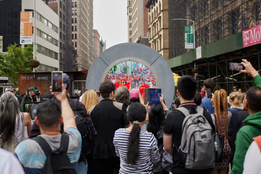 People gathered around portal installation in NYC