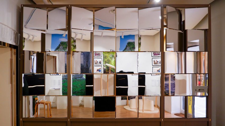 A photograph of an interior structure consisting of multiple mirrors within a wooden frame.