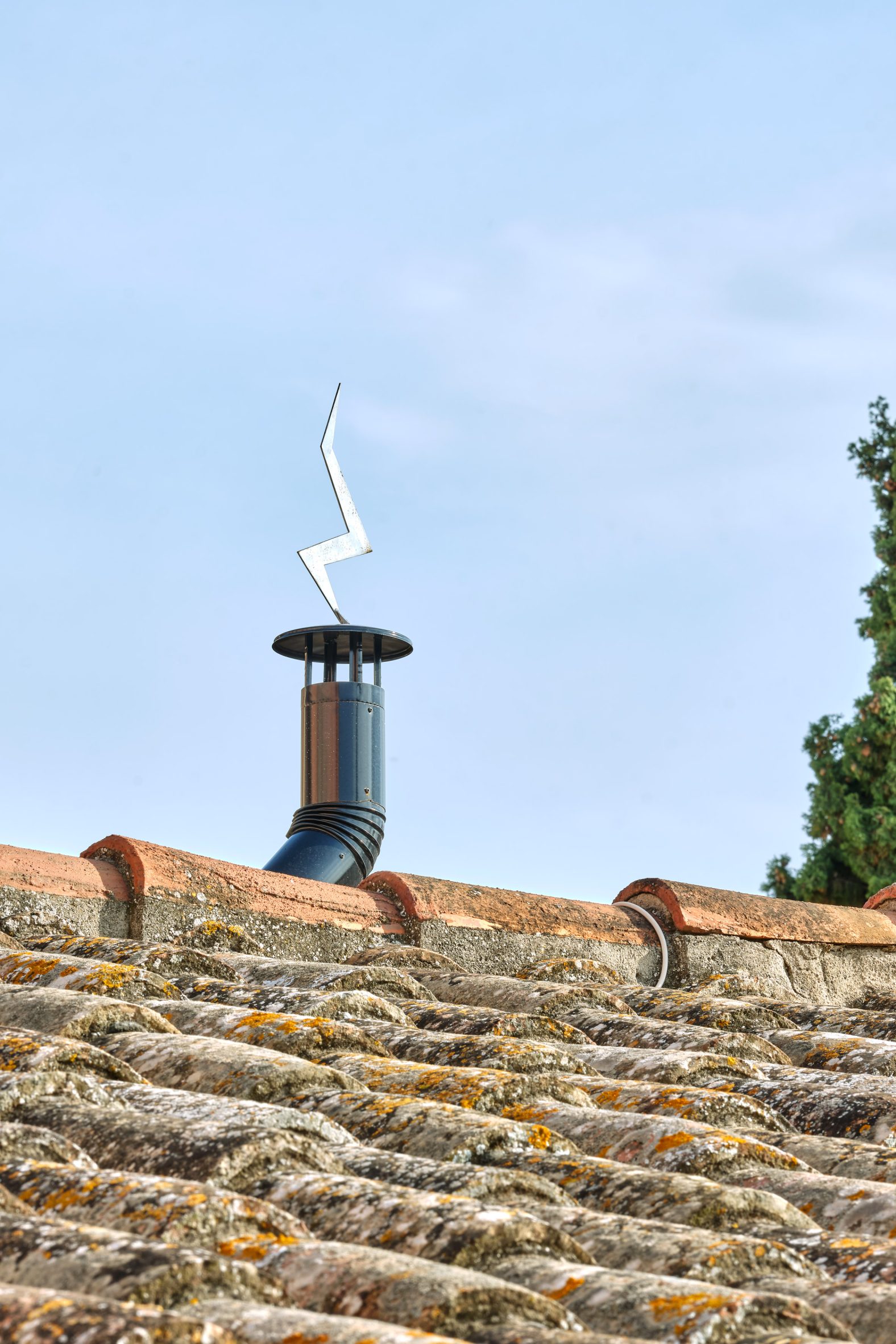 Sculptural lightning bolt sculpture coming out of the chimney