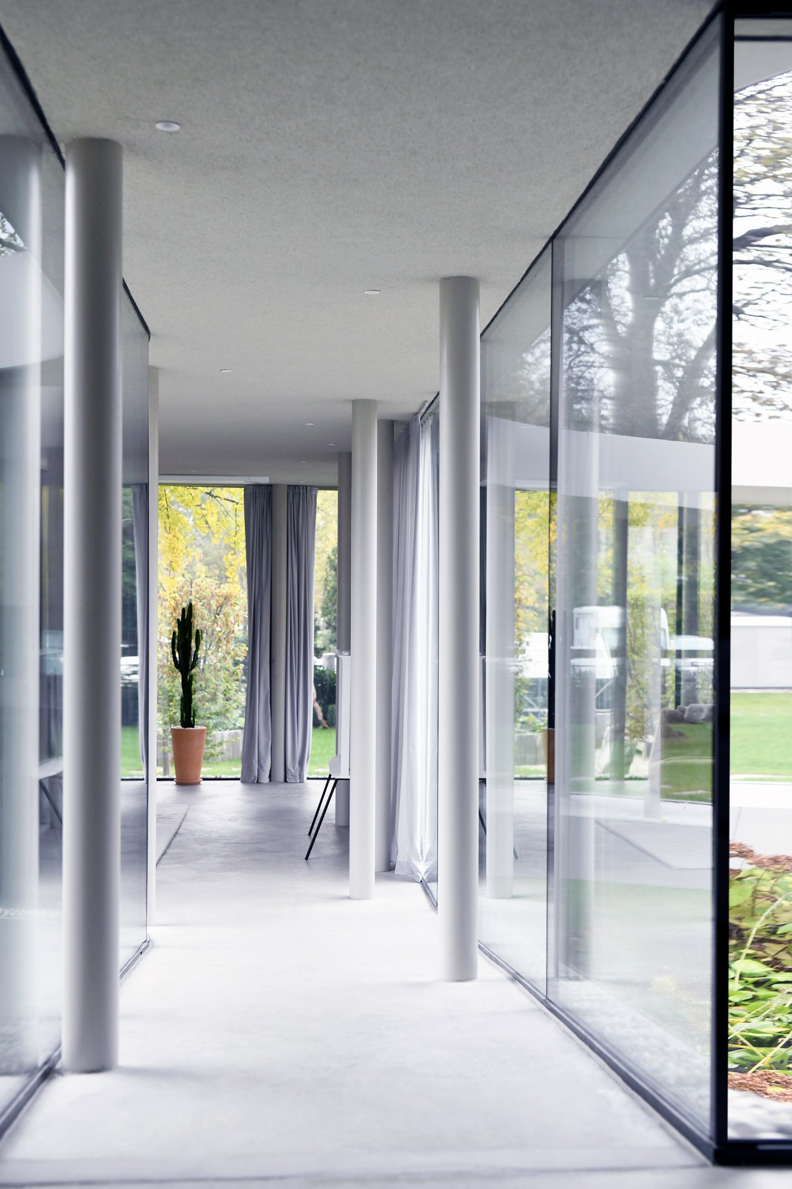 Glazed corridor in Ring House by OFIS Arhitekti