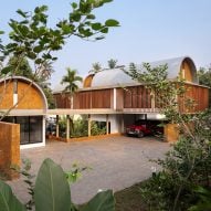 Vaulted roofs and laterite walls form "unapologetically modern" home in India