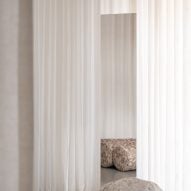 White curtains with boulder