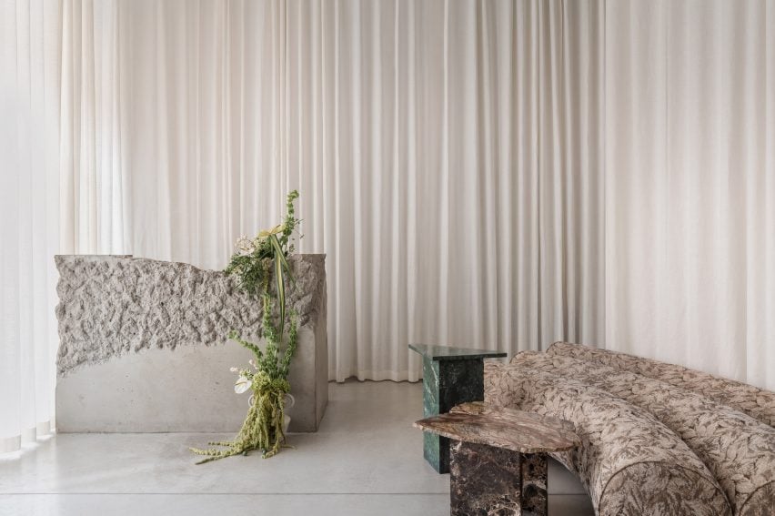Furniture in front of white curtain
