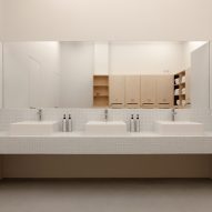 Bathroom with long sink and mirror