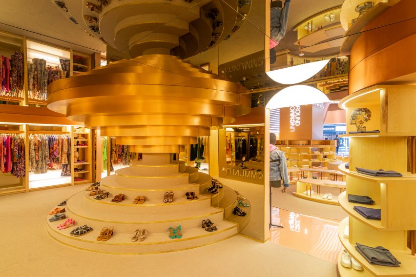 Brushed-brass bands above a stepped shoe display