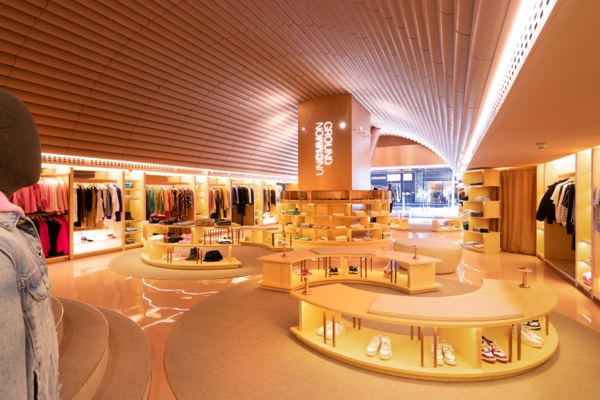 Store interior with cylindrical and arc-shaped furniture