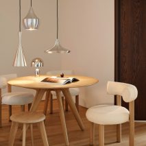 Photo of wooden table and chairs and lighting by Tom Dixon