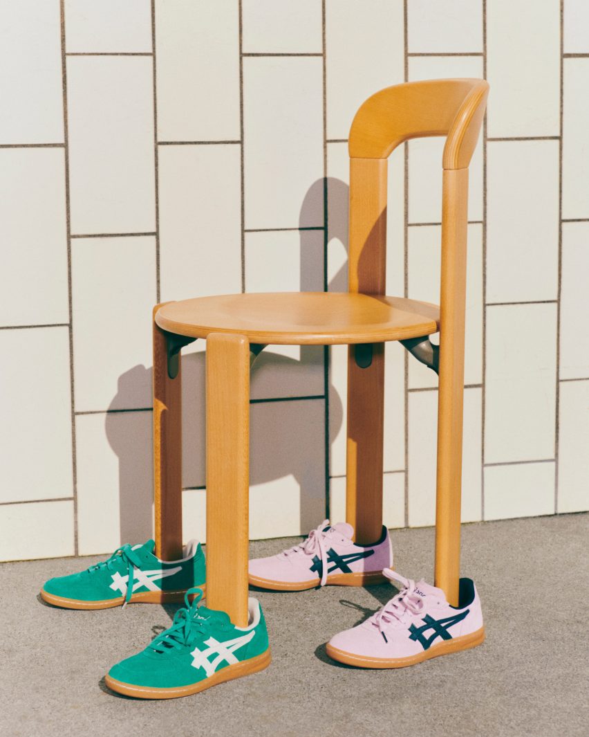 Pink and green trainers on a wooden chair