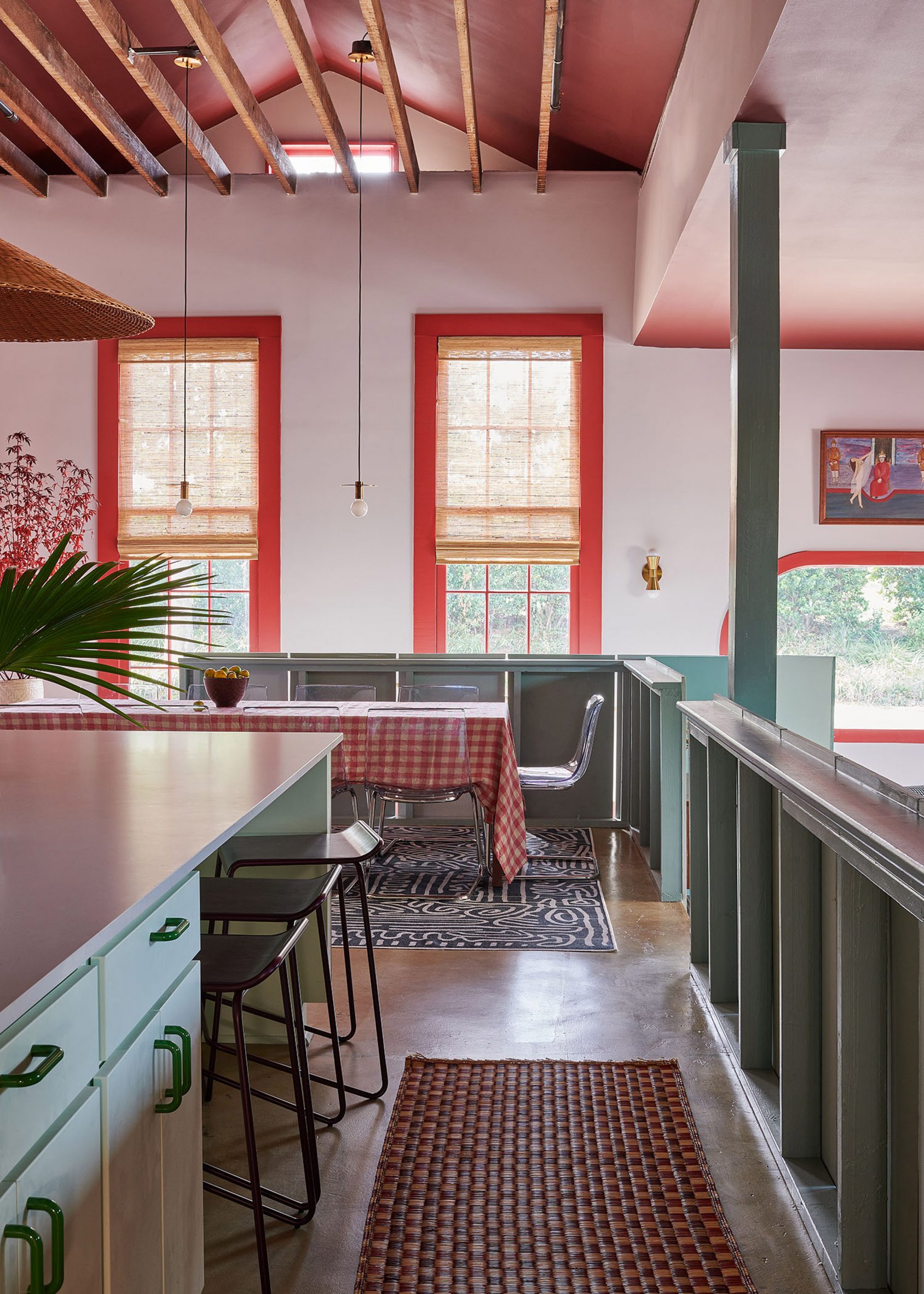 View from green kitchen to red-painted window frames