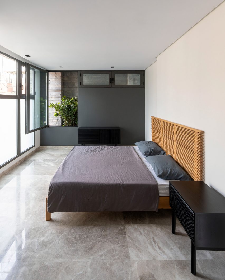 Bedroom interior within apartment building by Hooba Design Group