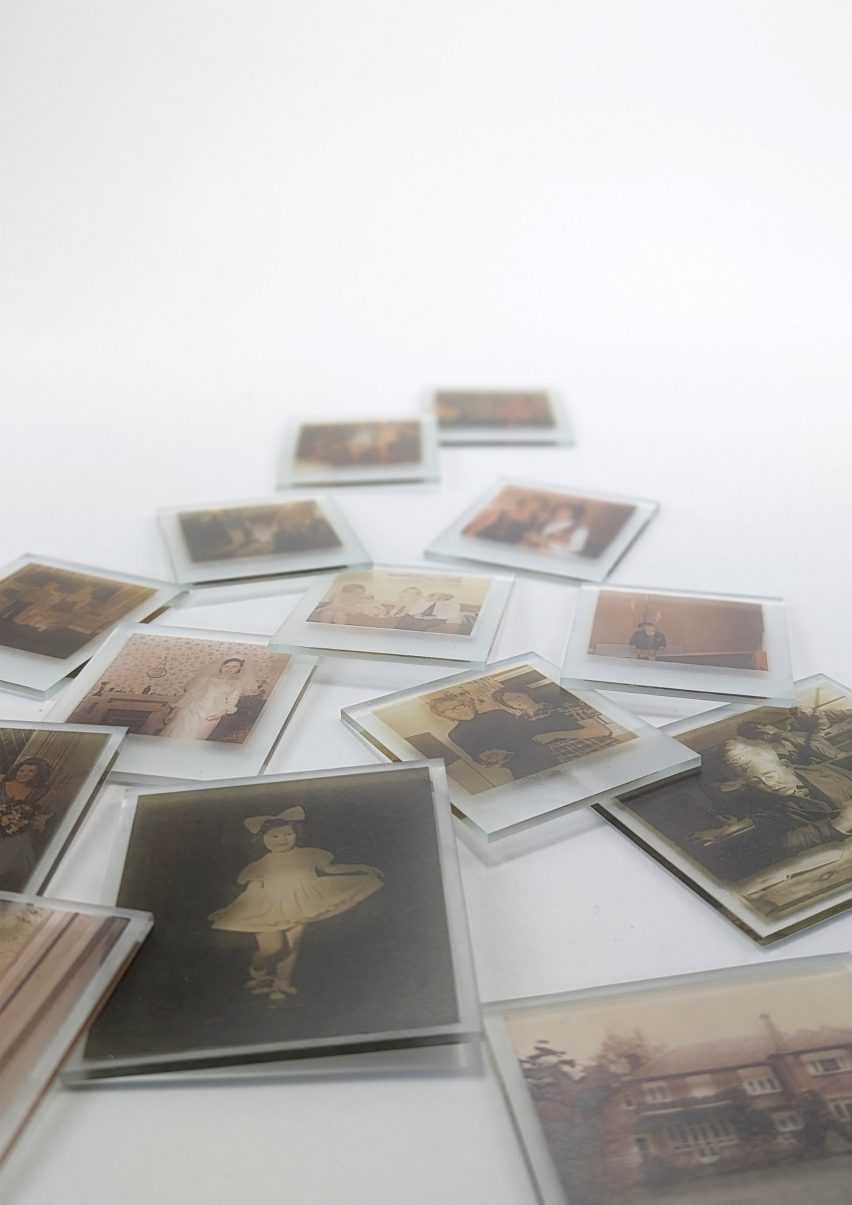 A photograph of printed images on plastic squares, laid on a white background.