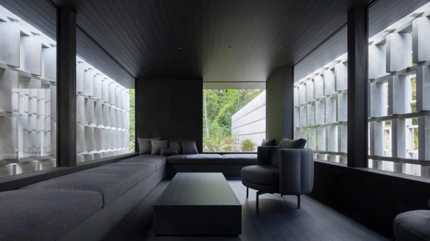Angled concrete blocks screen home in Japanese forest by Nendo