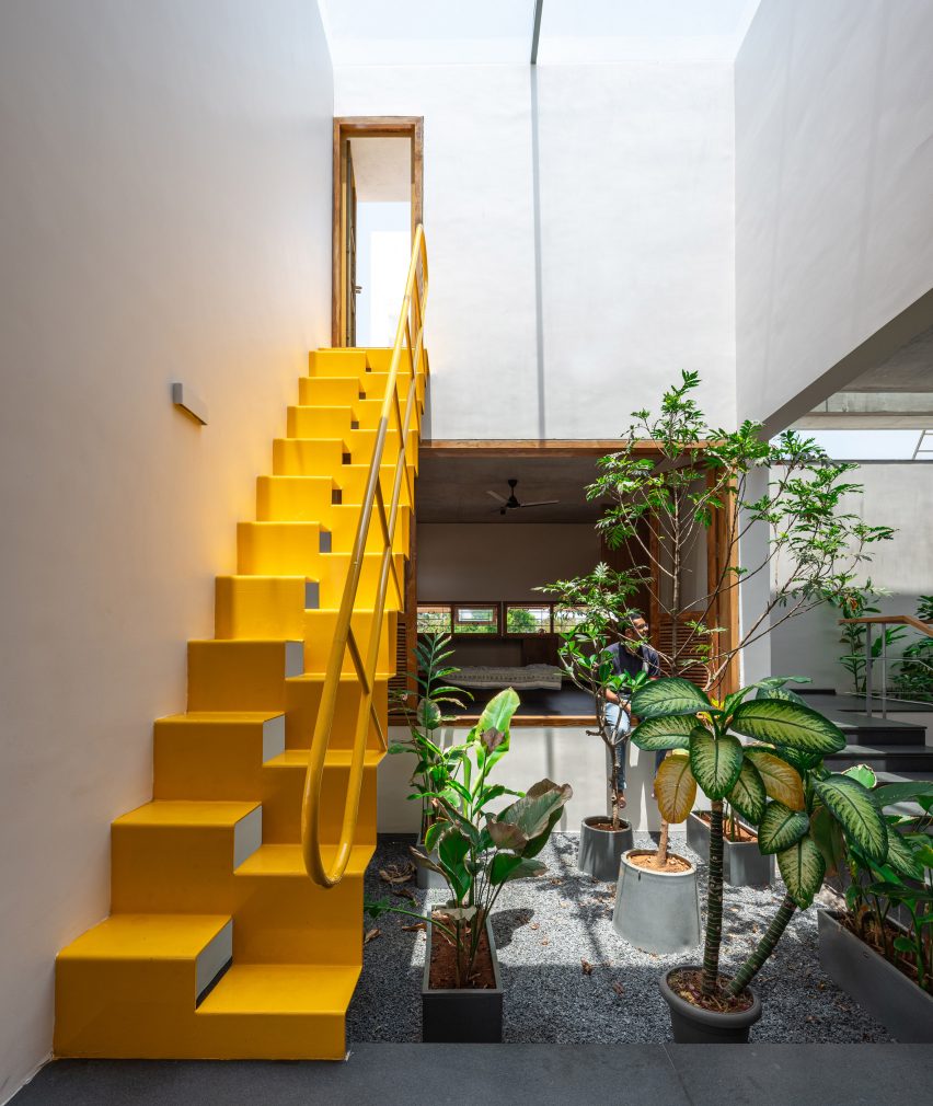 Yellow staircase at In-between Gardens by A Threshold