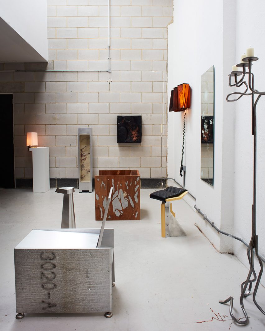 Steel table and metal candleholder in Max Radford Gallery