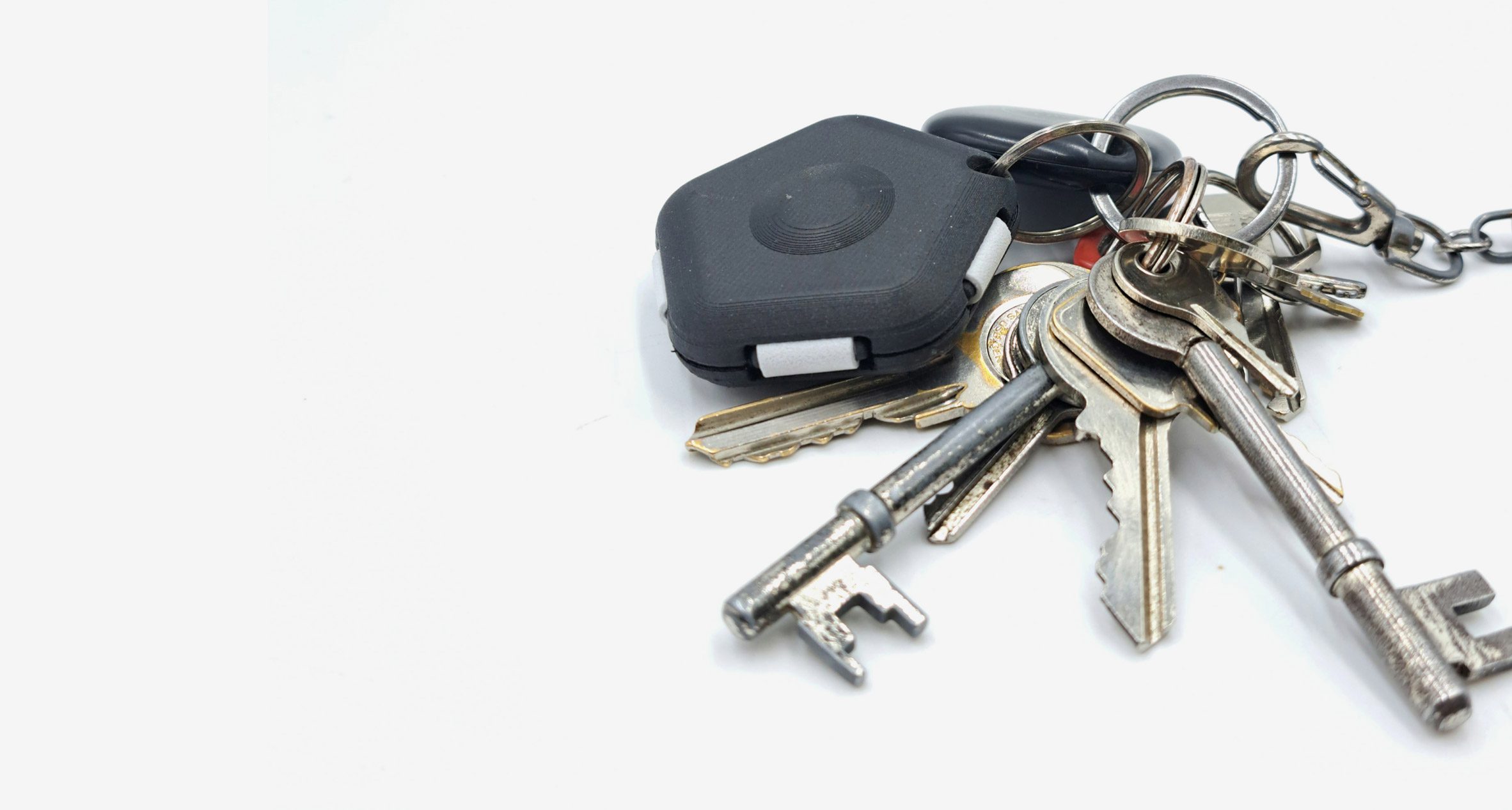 A photograph of a set of silver keys against a white background.