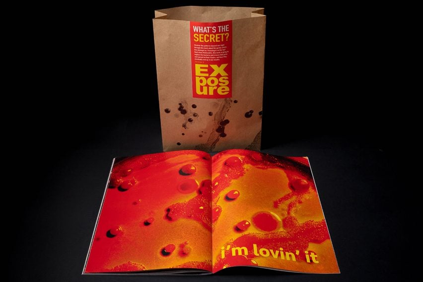 A photograph of a brown bag with a red label on it with yellow writing. In front of the bag is a publication, open on a double page spread that shows an orange image with the words 'i'm lovin it' in yellow writing over it.
