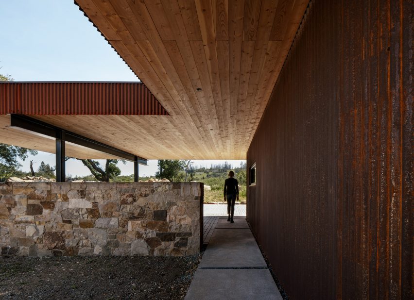 L-shaped building clad in weathering steel