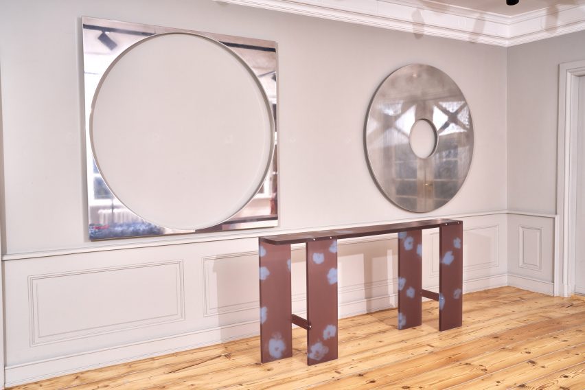 Steel cut-out mirrors and flower-printed table