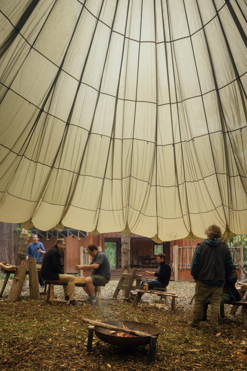 Military parachute repurposed as woodland shelter