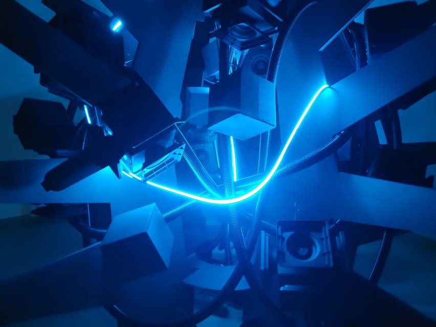 A visualisation displaying multiple wires and devices in blue tones, with a neon blue illuminated wire at the centre of the image.