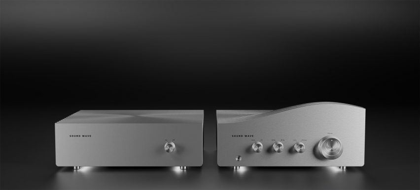 A photograph of a silver stereo system, split into two, against a black background.