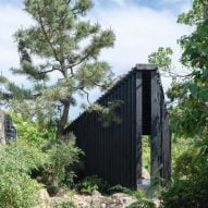 Temp nestles charred-wood pavilion in rocky Shanghai garden