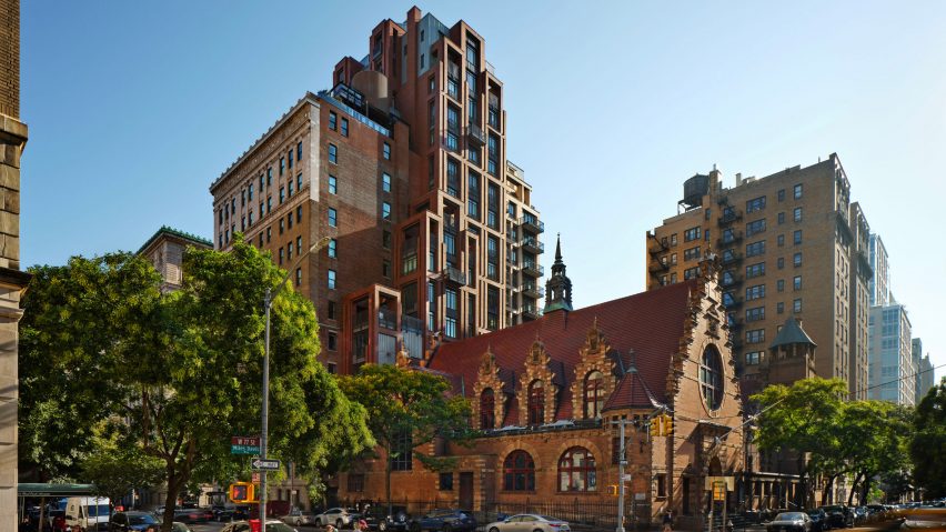 New York apartment building in front of church