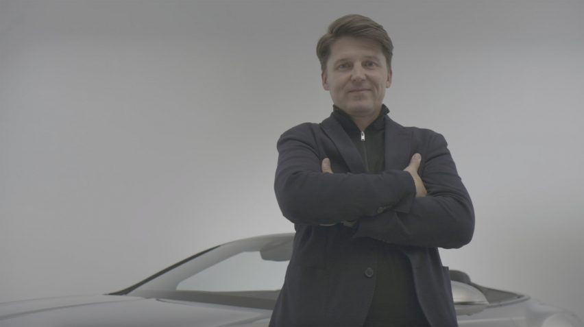 Markus Thiel in front of a car